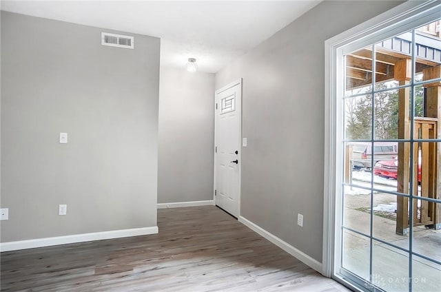 entryway with hardwood / wood-style flooring