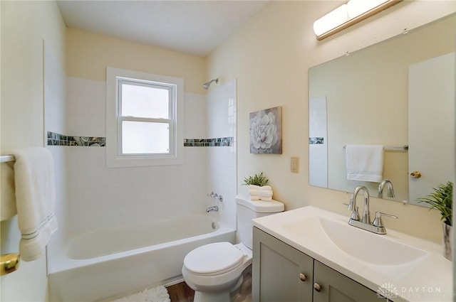 full bathroom with vanity, toilet, and tiled shower / bath combo