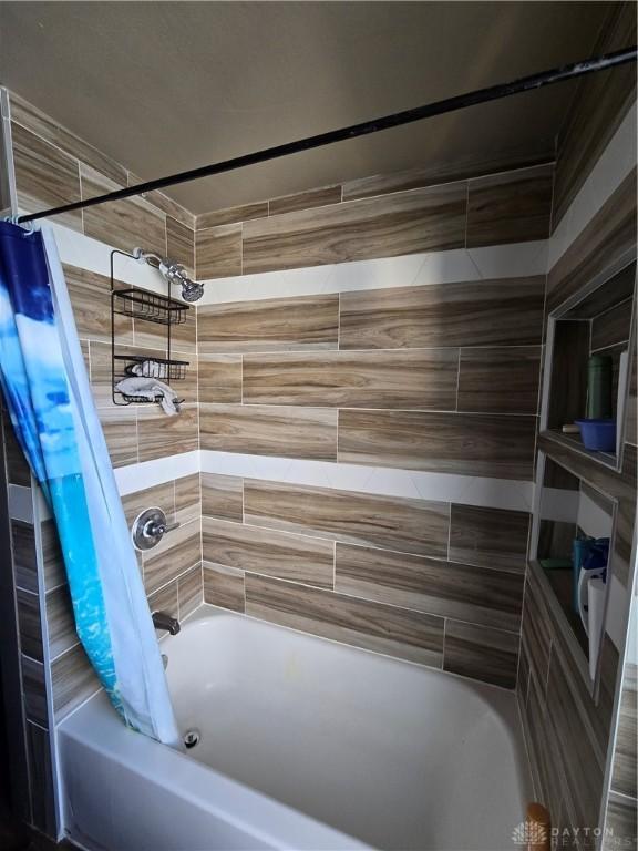 bathroom featuring shower / bath combination with curtain