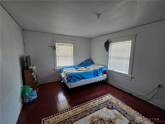 bedroom featuring dark wood-type flooring