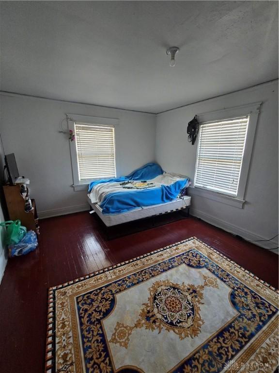 bedroom with hardwood / wood-style floors