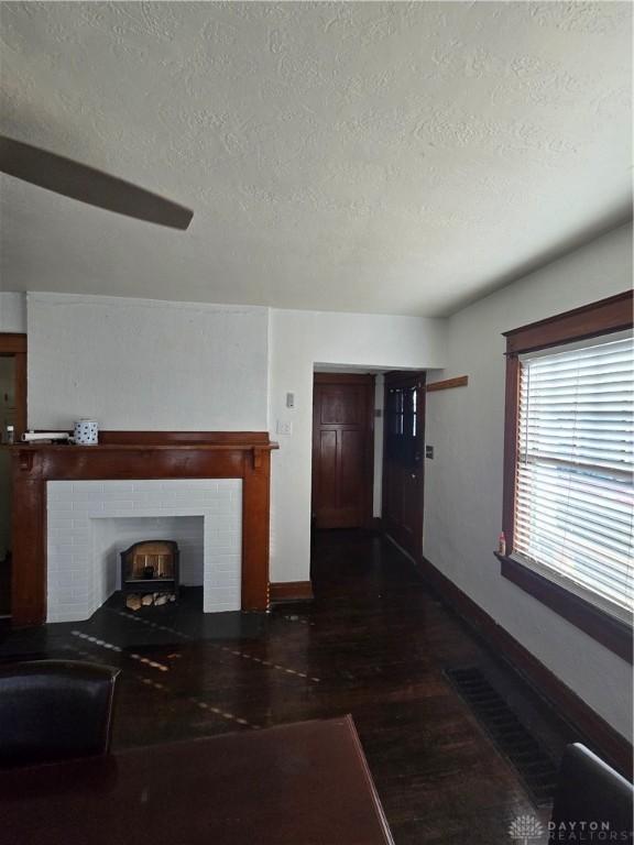 unfurnished living room with a textured ceiling