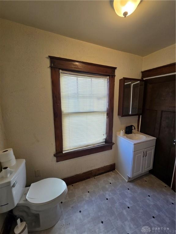 bathroom featuring vanity and toilet