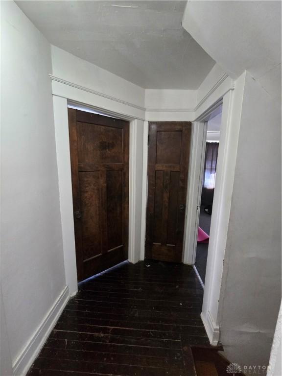 hall with dark wood-type flooring