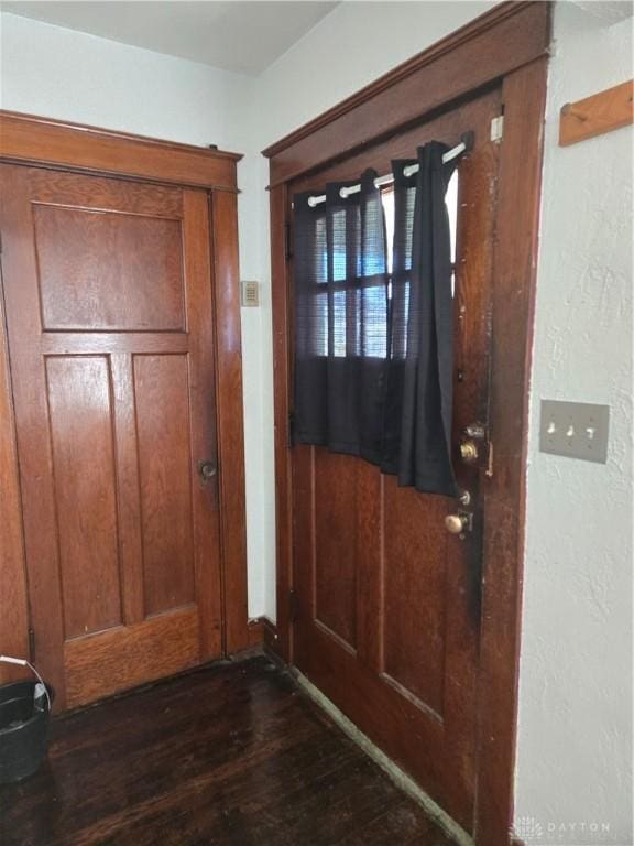 doorway to outside with dark hardwood / wood-style floors