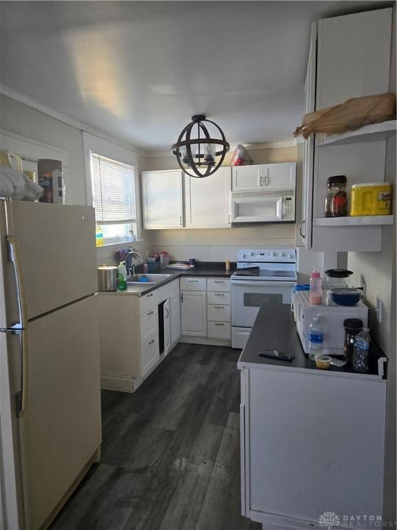 kitchen with dark hardwood / wood-style floors, white cabinetry, sink, crown molding, and white appliances