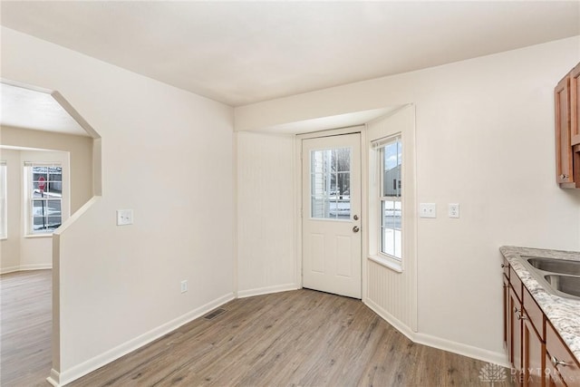 doorway to outside featuring light hardwood / wood-style floors