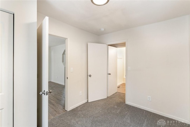 unfurnished bedroom featuring carpet flooring