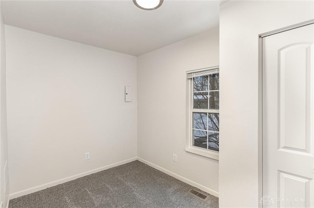 unfurnished room featuring carpet flooring