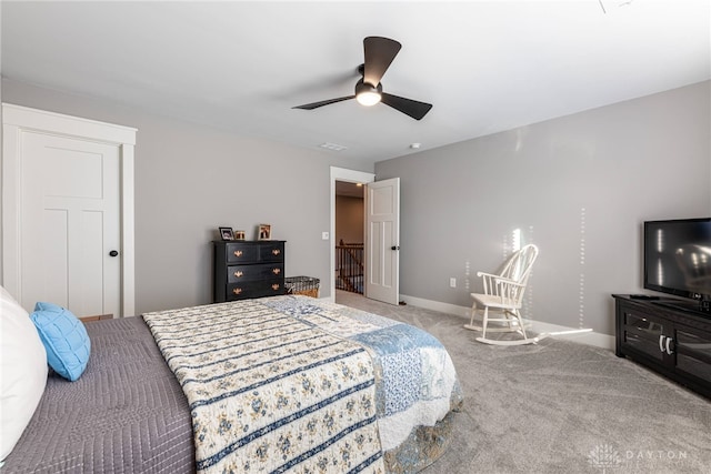 bedroom featuring ceiling fan and carpet