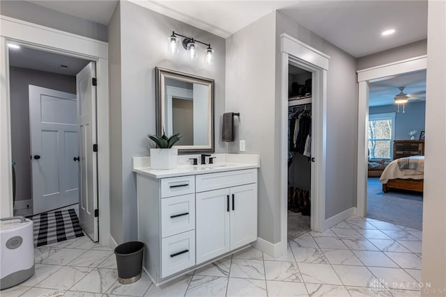 bathroom featuring vanity and ceiling fan