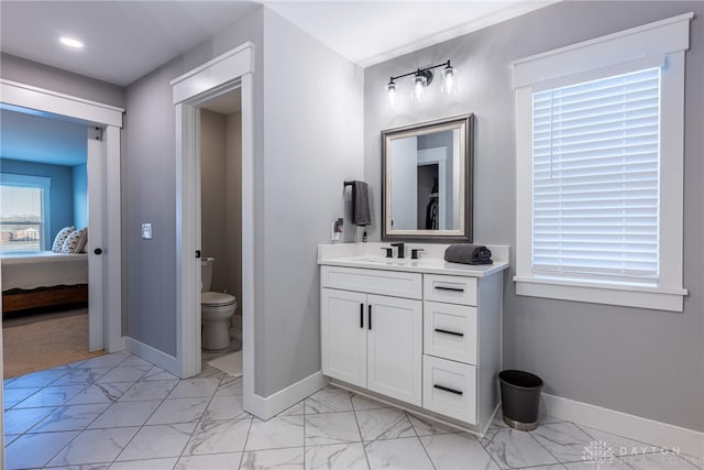 bathroom featuring vanity and toilet