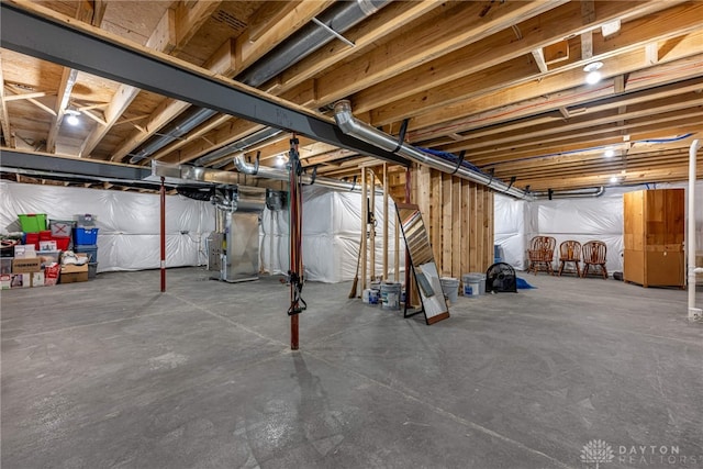 basement featuring heating unit