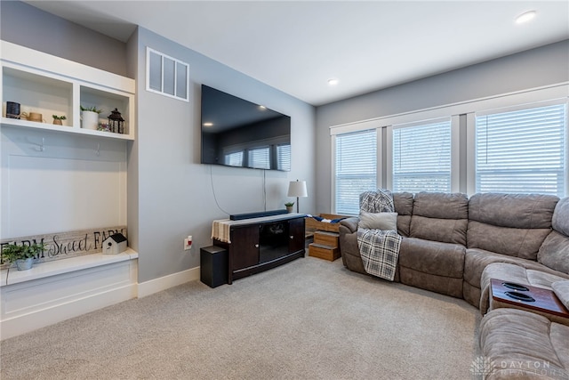 living room featuring light carpet