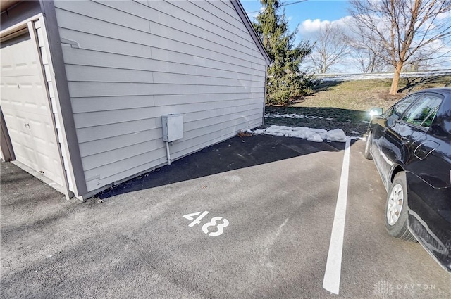 view of property exterior featuring a garage