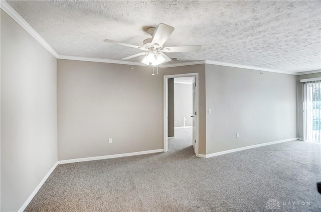 spare room with ceiling fan, ornamental molding, carpet, and a textured ceiling