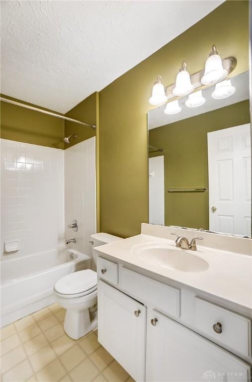 full bathroom featuring vanity, bathing tub / shower combination, a textured ceiling, and toilet