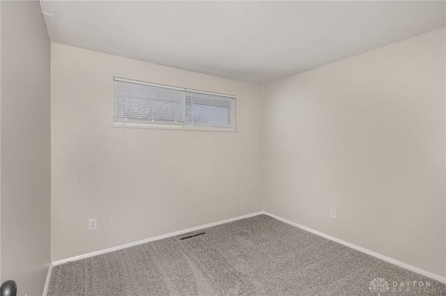 unfurnished room with carpet flooring