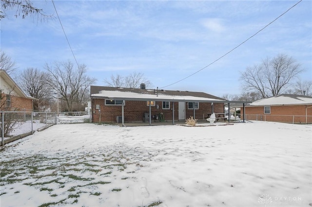 view of snow covered house