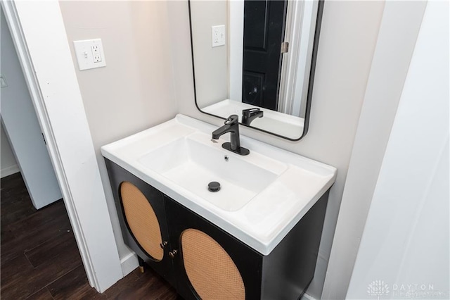 bathroom with hardwood / wood-style flooring and vanity