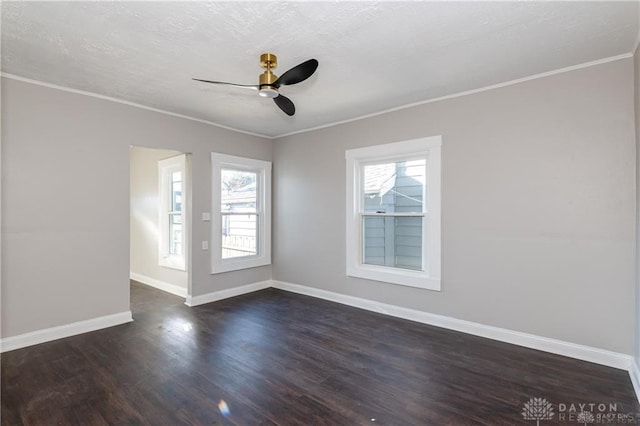 unfurnished room featuring ornamental molding, dark wood-type flooring, and ceiling fan