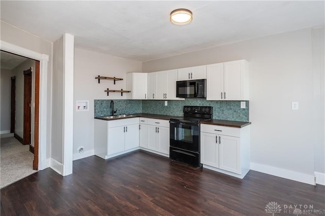 kitchen with tasteful backsplash, sink, white cabinets, dark hardwood / wood-style flooring, and black appliances