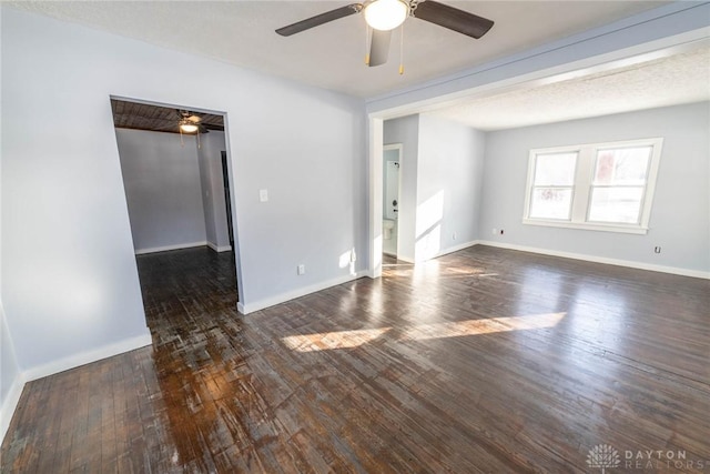 unfurnished room featuring dark hardwood / wood-style floors and ceiling fan