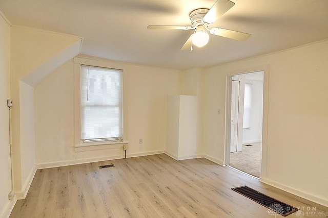 additional living space featuring light hardwood / wood-style floors and ceiling fan