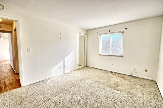 spare room featuring carpet flooring