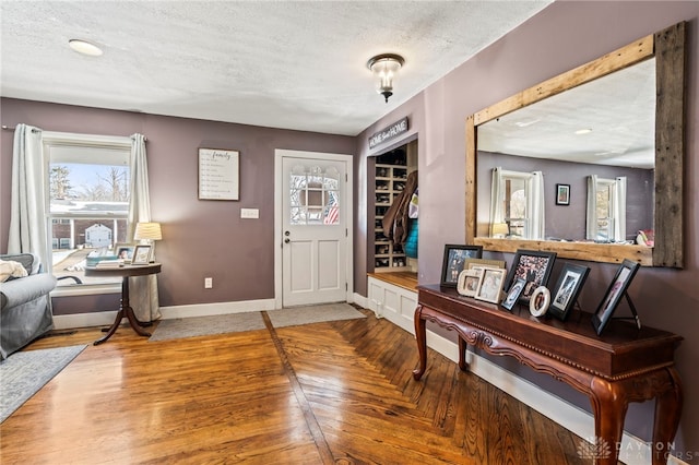 entryway with a textured ceiling