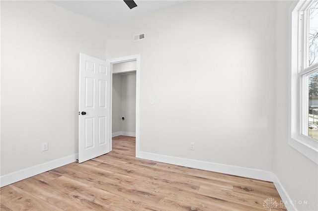 spare room featuring ceiling fan and light hardwood / wood-style flooring