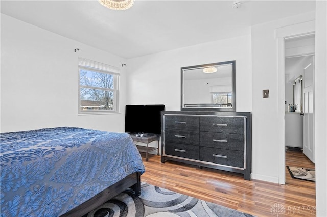 bedroom with hardwood / wood-style floors