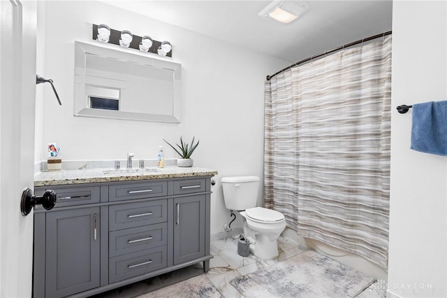 bathroom featuring vanity, a shower with curtain, and toilet