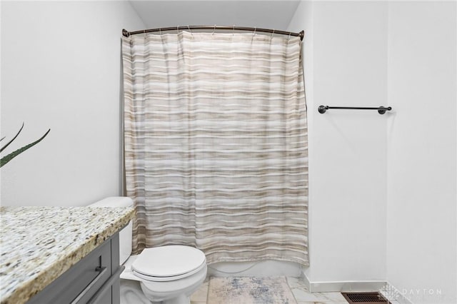 bathroom featuring vanity, toilet, and a shower with shower curtain