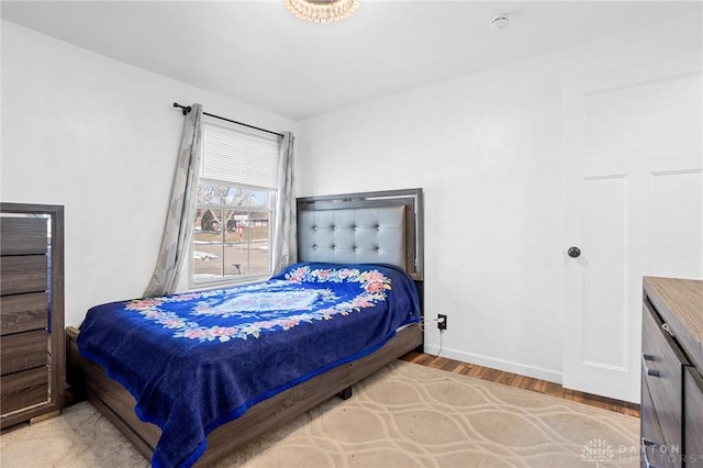 bedroom featuring wood-type flooring