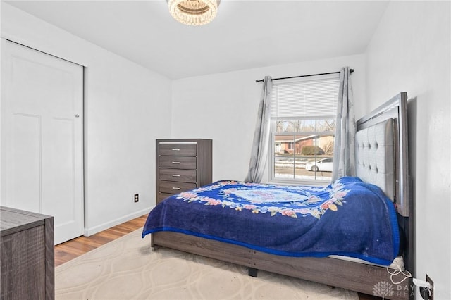 bedroom with hardwood / wood-style flooring