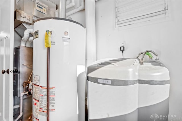 utility room featuring water heater