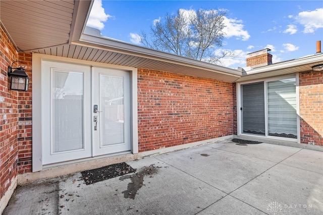 doorway to property with a patio and french doors