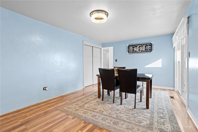 dining room with light hardwood / wood-style flooring