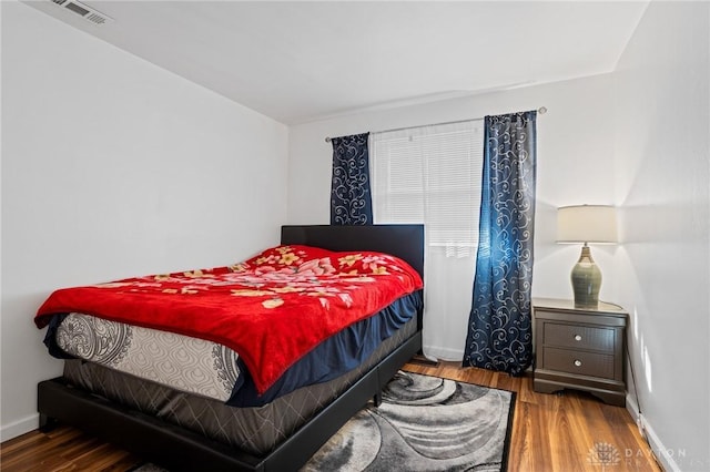 bedroom featuring hardwood / wood-style floors