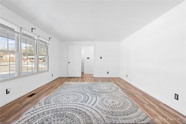 spare room with light wood-type flooring