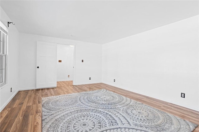 unfurnished room featuring hardwood / wood-style floors