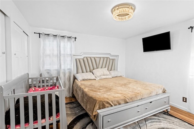 bedroom with hardwood / wood-style floors