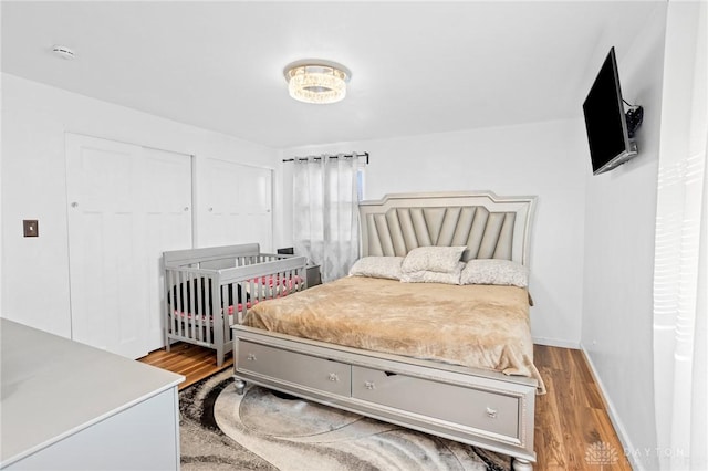 bedroom with hardwood / wood-style flooring