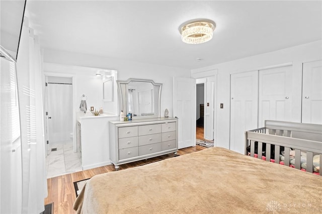 bedroom featuring light wood-type flooring