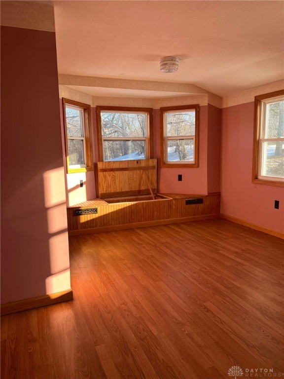 empty room featuring hardwood / wood-style flooring