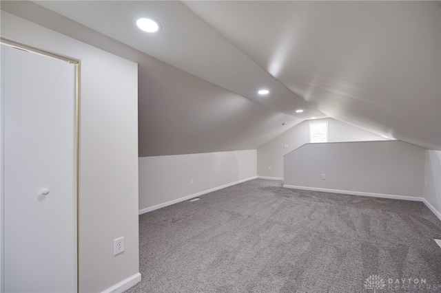 bonus room with lofted ceiling, recessed lighting, baseboards, and carpet floors