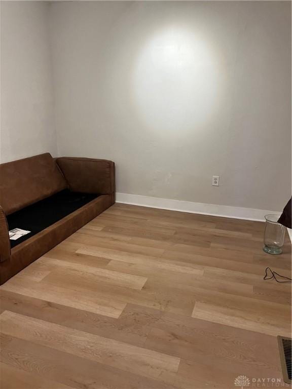 unfurnished room featuring hardwood / wood-style flooring