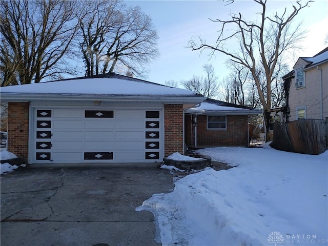 single story home featuring a garage