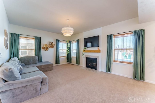 living room with a healthy amount of sunlight and light colored carpet